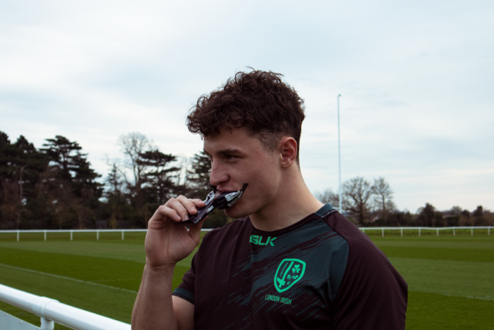 London Irish player Henry Arundell eating a Pro X bar