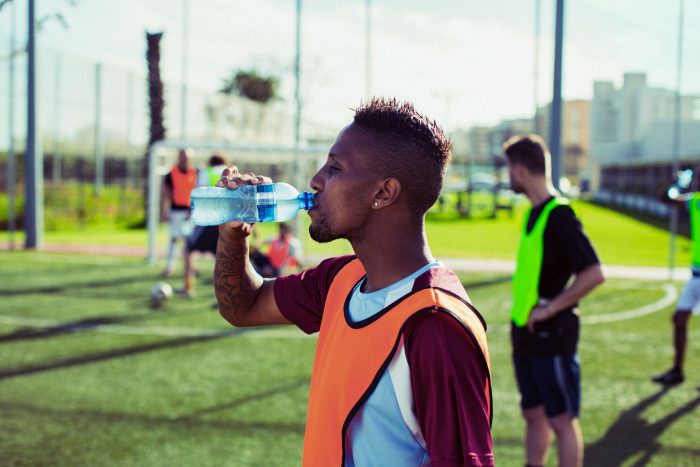 Football Player Drinking Water